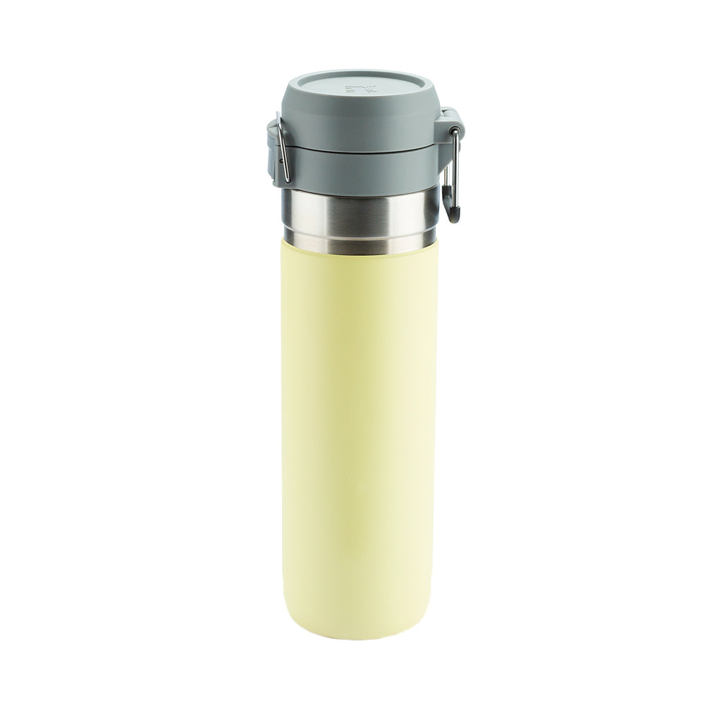 Copo térmico amarelo-claro com tampa cinza.